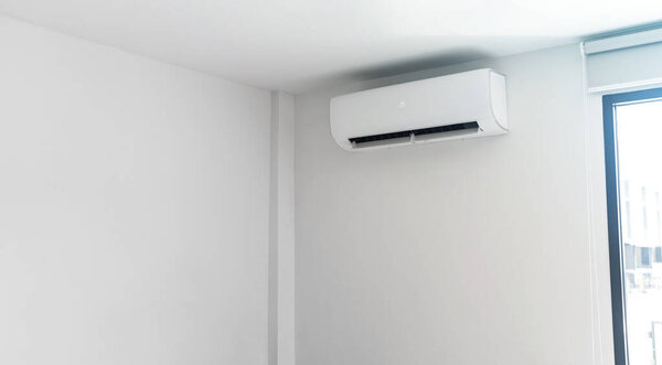  Air conditioner on white wall background