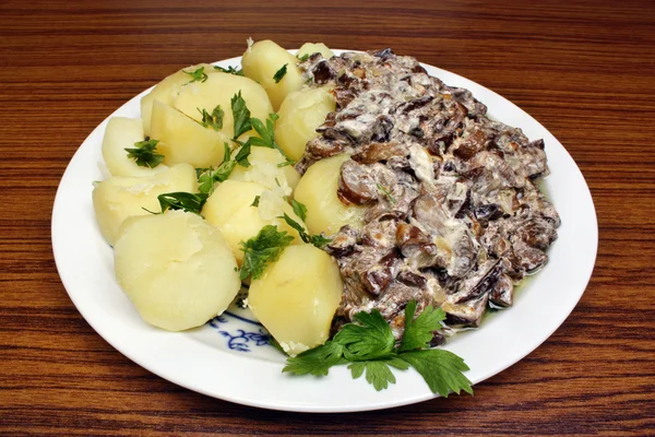 Mushroom sauce with potatoes — Stock Photo, Image