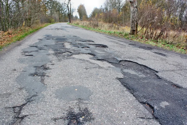 Damaged asphalt — Stock Photo, Image