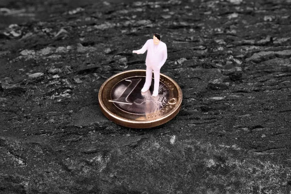 Miniature figure businessman on euro — Stock Photo, Image