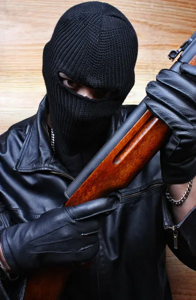 Gangster terrorist mafia criminal with a gun — Stock Photo, Image