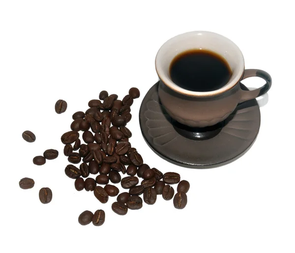 Kahve fincanı ve kahve çekirdeği.