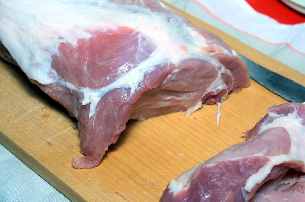 Cutting of pork meat — Stock Photo, Image