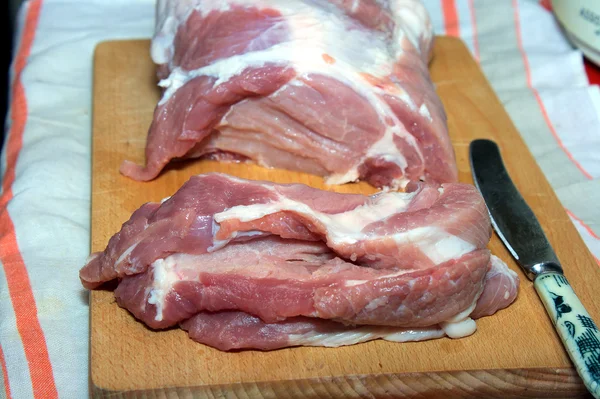 Cutting of pork meat — Stock Photo, Image