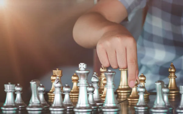 Concentrated Serious Boy Moving Gold Pawn Chess Figure Competition Success — Stock Photo, Image