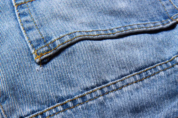 蓝色牛仔裤的口袋 摘要背景 色彩艳丽的背景经典牛仔裤面料 靠近点 — 图库照片