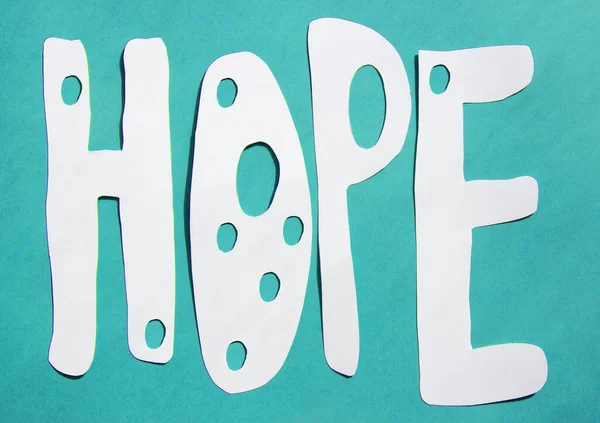 Paper art. Word Hope on a bright background with contrasting shadows — Stock Photo, Image