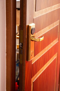 Ajar door in the hotel. Wooden door