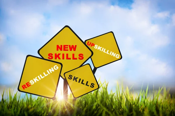 New Skills Upskilling Reskilling Skills Written Yellow Sign Grasses Sky Rechtenvrije Stockafbeeldingen