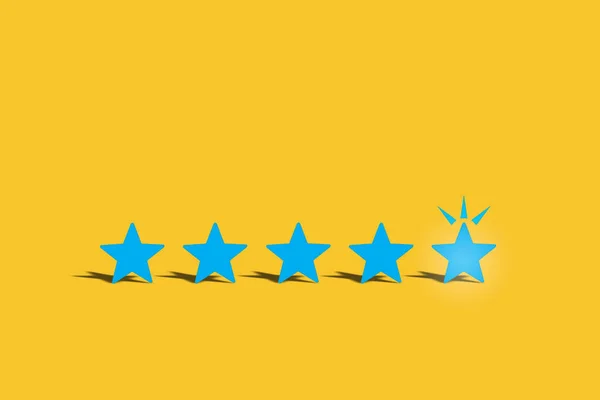 Blue five stars feedback on yellow background. Business success concept and excellent idea