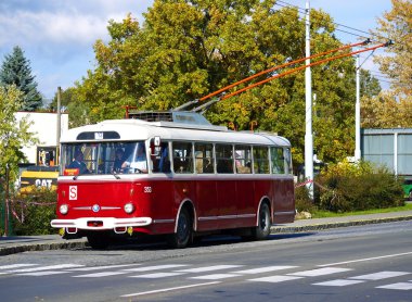Old red trolley car Skoda 9Tr at the bus station clipart