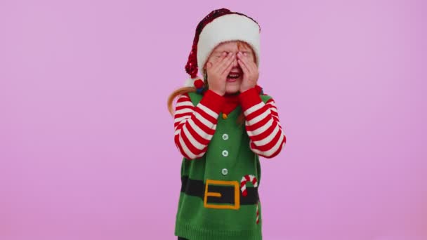 Upset disappointed girl Christmas Santa Claus Elf wipes tears, cries from despair not received gift — Stock Video