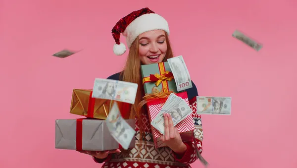 Christmas Girl holding gift boxes, concept of spending money, shopping online, cash dollars falling — Stock Photo, Image