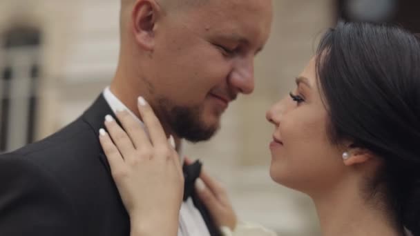 Newlyweds portrait, caucasian groom bride walking, embracing, hugs near old castle, wedding couple — Video Stock