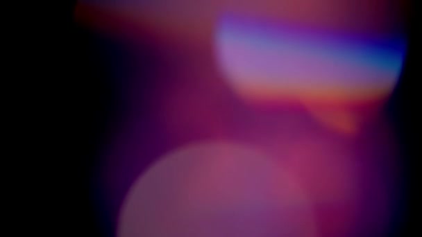 Multicolored light leaks 4k footage on black background, Stylizing video, transitions, Bokeh effect — Stock video