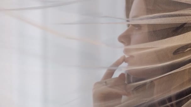 Portrait of bride face close-up under veil, girl touching her lips, wedding morning preparations — Stock Video