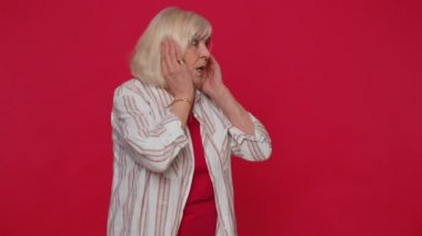 Woman scared fearful, covering ears, meeting her own phobia, evidence horror event, screaming loud