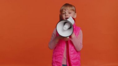 Smiling toddler girl talking with megaphone, proclaiming news, loudly announcing sale advertisement