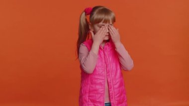 Toddler children girl kid closing eyes with hand showing stop gesture, confused shy scared to watch