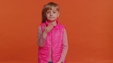 Frightened scared child girl closing his mouth gestures no, refusing to tell terrible secret, truth