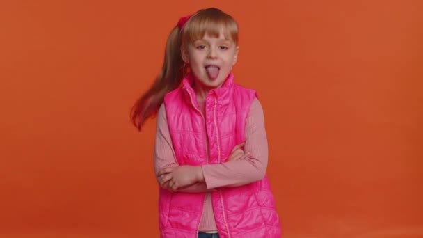 Funny girl kid showing tongue making faces at camera, fooling around, joking, aping with silly face — Stock Video