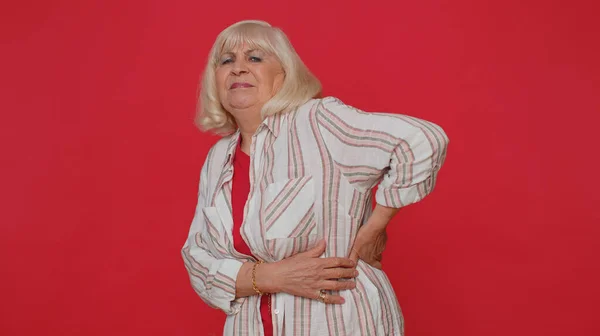 Senior ill woman suffering backache discomfort unbearable spasm torn muscles, tendons kidney stones — Stockfoto