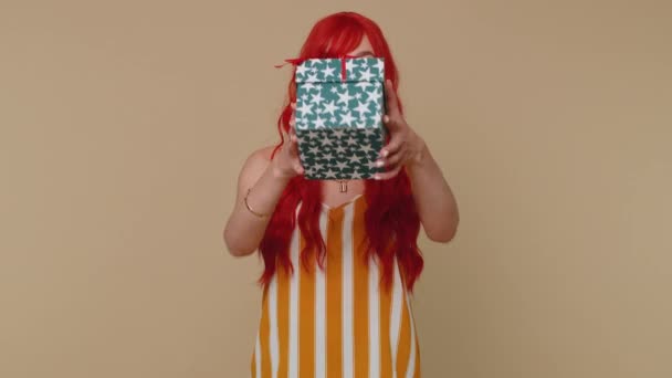 Smiling Redhead Young Woman Presenting Birthday Gift Box Stretches Out — Stock Video