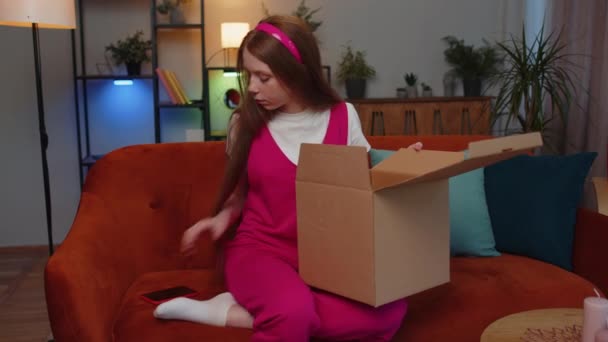 Angry Unsatisfied Shopper Teen Redhead Children Girl Unpacking Parcel Feeling — стоковое видео