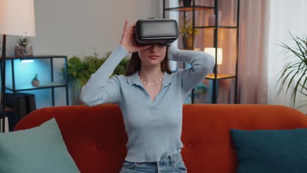 Young Woman Using Virtual Reality Futuristic Technology App Headset Helmet — Stockvideo