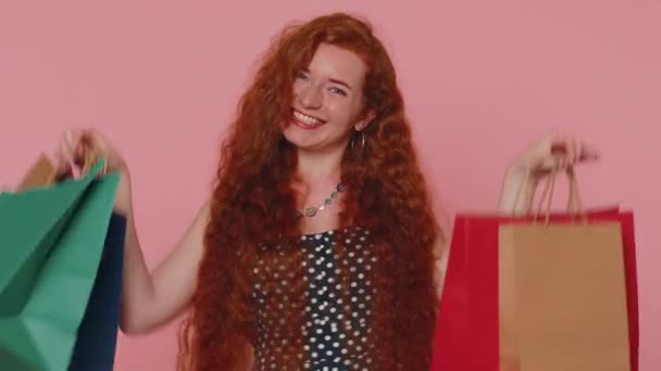Happy Redhead Shopaholic Woman Showing Shopping Bags Advertising Discounts Smiling — Stock videók