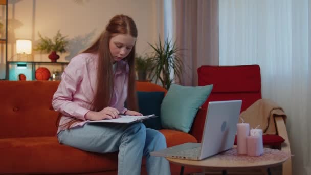 Sad Teen Child Girl Working Online Laptop Analysing Paperwork Graphs — Stock Video