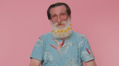 Lovely cheerful senior old man greatly approves your suggestion, shaking head approvely, satisfied with good quality work, like proposal. Elderly grandfather isolated on pink studio wall background