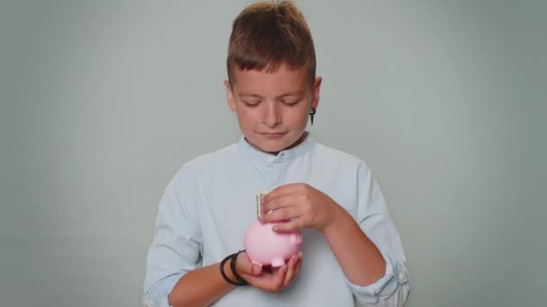 Poor Boy Kid Upset Insufficient Amount Money Holding Piggybank One — стоковое видео