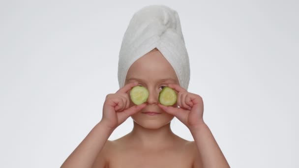 Beautiful Young Smiling Child Girl Holding Slices Cucumber Covering Eyes — Video Stock