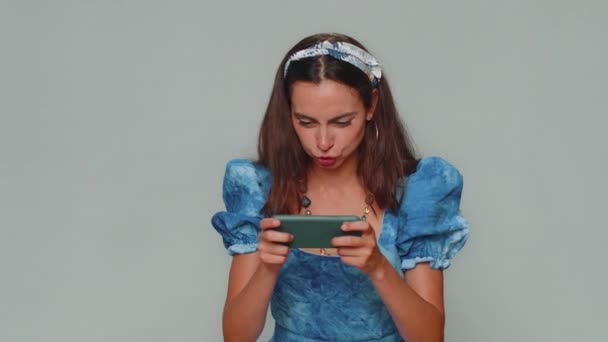 Worried Funny Young Woman Blue Dress Enthusiastically Playing Racing Shooter — Αρχείο Βίντεο