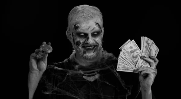 Creepy smiling man with bloody scars face, Halloween zombie showing golden bitcoins with money dollar cash banknotes. Achievement career wealth, cryptocurrency investment, mining, future technology