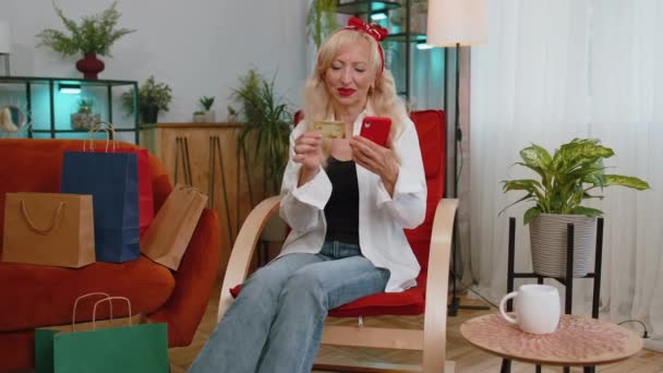 Happy Shopaholic Consumer Senior Grandmother Woman Sitting Home Making Online — Video