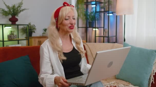 Senior Grandmother Sitting Couch Looking Laptop Making Video Webcam Conference — Stockvideo