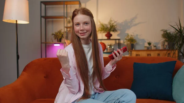 Happy Excited Joyful Redhead Teen Child Girl Use Mobile Smartphone — Stockfoto