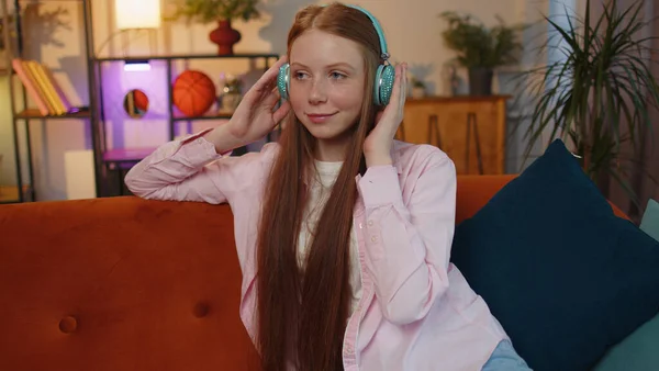 Happy Relaxed Overjoyed Ginger Kid Wireless Headphones Dancing Couch Home — 스톡 사진