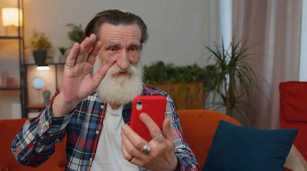 Senior Old Grandfather Man Wearing Earphones Making Phone Online Conversation — Photo