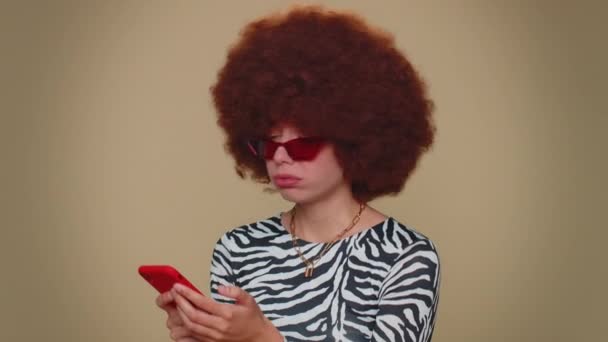 Sad Young Woman Brown Lush Wig Use Smartphone Typing Browsing — Αρχείο Βίντεο