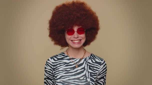 Cheerful Lovely Pretty Young Woman Brown Lush Wig Red Sunglasses — Stockvideo
