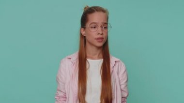 Stressed depressed girl terrified about danger problems, suffering phobia, anxiety disorder, expresses fear, waving no, insecure, stress, panic. Child kid isolated on blue studio background indoors