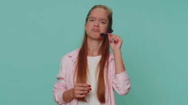 Smiling pretty teenager young girl wearing headset, freelance worker, call center or support service operator helpline, having talk with client or colleague, communication support. Student child kid