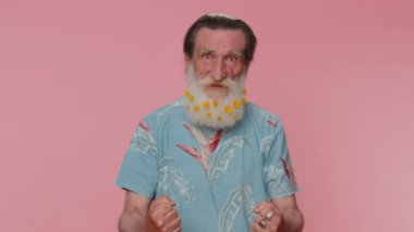 Dissatisfied man shaking head no, asking reason of failure, expressing disbelief irritation, feeling bored, disappointed in result, bad news. Senior grandfather isolated on pink studio wall background