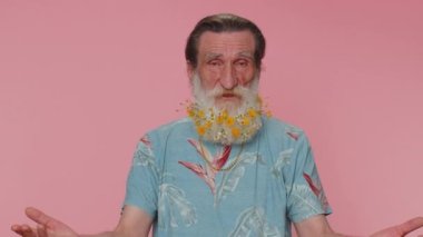 I cant believe. Why you did that. Upset annoyed elderly man raising hands in indignant expression, quarreling, asking reason of conflict, why such stubborn. Senior old grandfather on pink background