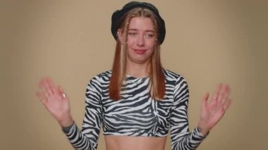 I am dont want it, not me. Confused upset young woman pointing fingers herself ask say who why me no thanks i do not need it, rejection, refusal, stop sign. Adult stylish girl on beige background