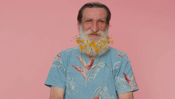 Cheerful Lovely Elderly Man Beard Flowers Blue Shirt Smiling Looking — Stok fotoğraf