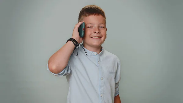 Toddler Kid Boy Shirt Having Pleasant Mobile Conversation Using Smartphone — Zdjęcie stockowe